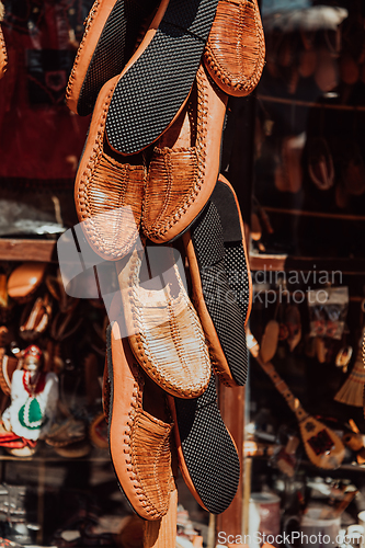 Image of Macedonian folklore, brown sandals. Old shoes. Part of the tradition. Black pants, close up