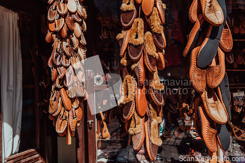 Image of Macedonian folklore, brown sandals. Old shoes. Part of the tradition. Black pants, close up