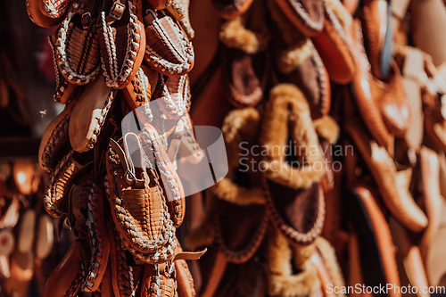 Image of Macedonian folklore, brown sandals. Old shoes. Part of the tradition. Black pants, close up