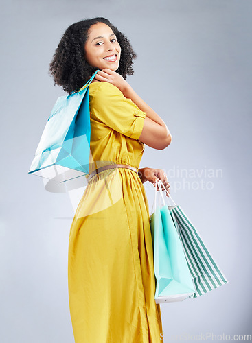 Image of Shopping bag, fashion and young woman for happy discount, sale and retail promotion on a white background. Winning gift, giveaway and customer, model or african person in clothes portrait and studio