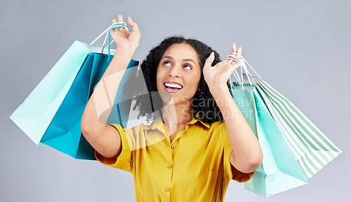 Image of Thinking, shopping bag and a woman in studio for fashion sale, promotion or retail discount. Excited female model or happy customer on a white background advertising commerce offer, deal or gift