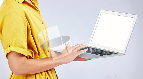 Image of Woman hands, laptop screen and presentation mockup, e commerce advertising and fashion or creative website in studio. Person typing on computer with space or search information on a white background