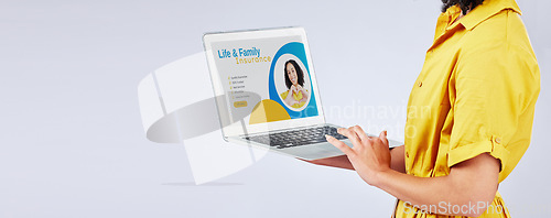 Image of Laptop, insurance and security with a customer in studio on a gray background for life cover sign up. Computer, website and mockup with a female person searching for information about protection
