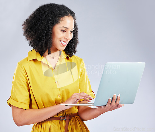 Image of Laptop, typing and business woman for online marketing, social media planning and copywriting research. Editing, blog and creative worker or African person on computer on a white background in studio