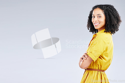 Image of Portrait, fashion and mockup with a woman arms crossed in studio on a white background for trendy style. Yellow, smile and banner with a happy young person with an afro in a clothes outfit on space