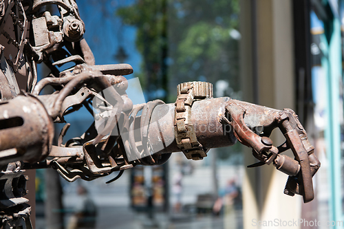 Image of An old robot in the streets of a Macedonian city. The concept of the future and robotics