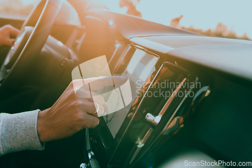 Image of Close-up Of Man Hand Using GPS Navigation Inside Car