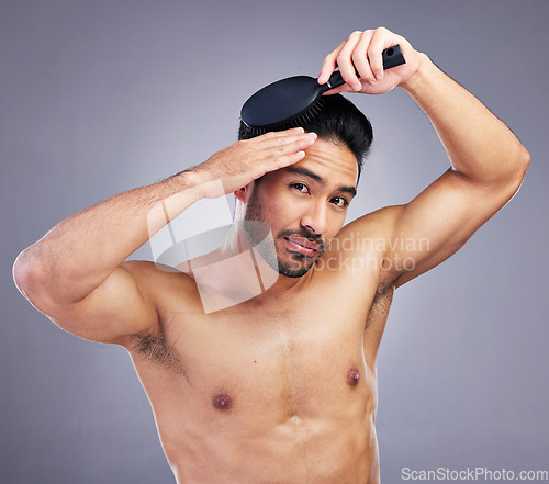 Image of Portrait, topless or man brushing hair in grooming with salon haircare product on studio background. Natural person, brush or confident healthy Asian male model with cool hairstyle in morning routine