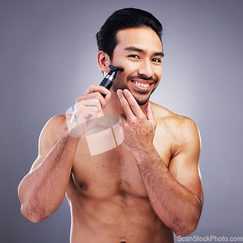 Image of Beard hair trimmer, portrait or happy man with bathroom routine, grooming or morning smile for shaving skincare. Face cleaning, facial growth maintenance or studio person happiness on gray background