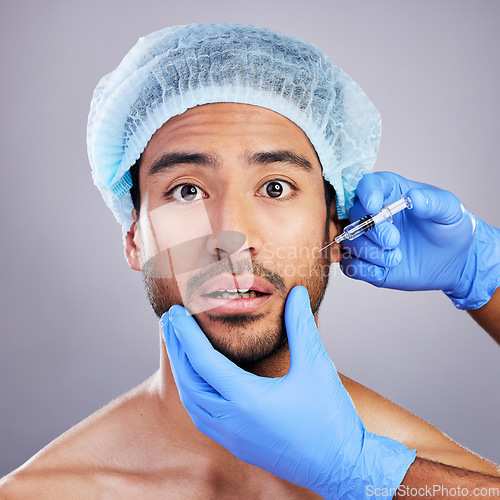 Image of Hands, portrait and plastic surgery with a man in studio on a gray background for a botox injection. Face, beauty and transformation with a male customer in a clinic for antiaging filler or cosmetics