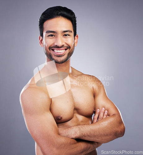 Image of Skincare portrait, studio arms crossed and happy man with morning treatment, hygiene health or body wellness. Bathroom, self care and confident person smile for cosmetics results on gray background