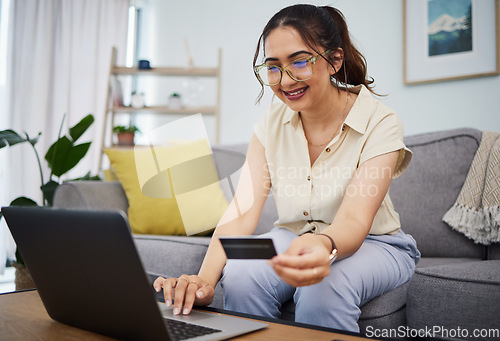 Image of Woman, credit card and online shopping on laptop in home for digital payment, fintech and ecommerce. Happy female person, computer and internet banking for financial sales, password and web account