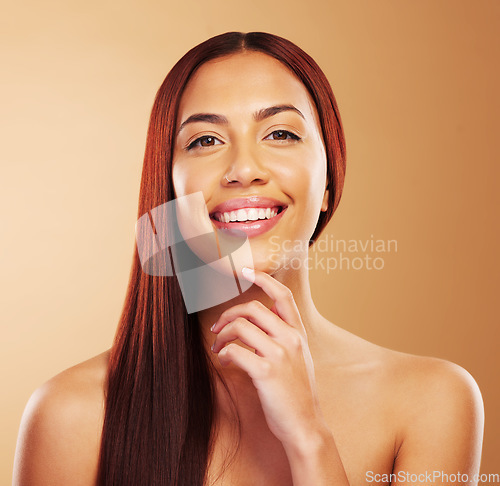 Image of Hair care, beauty and portrait of woman with smile, hand on skin and luxury salon treatment on brown background. Aesthetic, haircut and haircare, happy face of model in cosmetics and makeup in studio