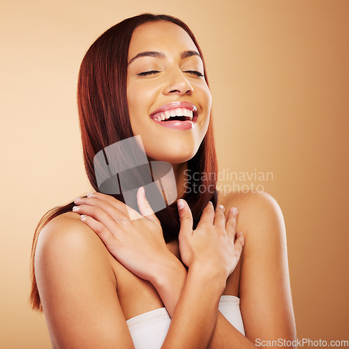 Image of Hair care, beauty and woman with smile, hands on skin and luxury salon treatment on brown background. Aesthetic glow, haircut and haircare, happy face of model with cosmetics and makeup in studio.