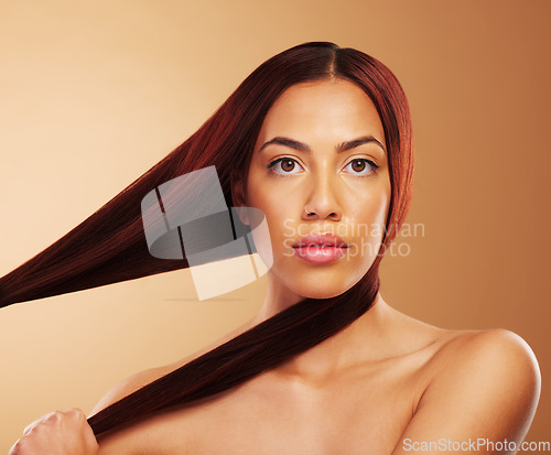 Image of Aesthetic, beauty and portrait of woman with strong hair in hands, luxury salon treatment and brown background. Natural glow, haircut and haircare, face of model with cosmetics and makeup in studio.