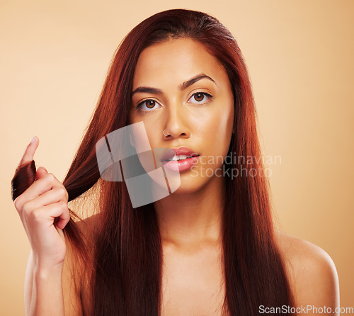 Image of Hair care, beauty and portrait of serious woman with hands on luxury salon treatment on brown background. Natural aesthetic, haircut and haircare, face of model with cosmetics and makeup in studio.