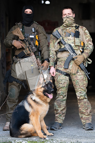 Image of Modern Warfare Soldiers with military working dog in action on the battlefield.