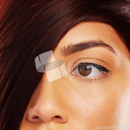 Image of Vision, hair and eye with a model woman closeup for skincare, beauty or makeup for luxury aesthetic. Face, wellness and a young person with a nose ring in the salon for haircare or cosmetic treatment