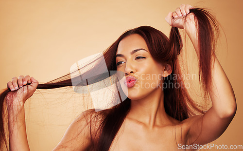 Image of Haircare, beauty and happy woman with hair in hands, luxury salon treatment and brown background space. Aesthetic, haircut and smile, excited model with cosmetics and keratin kiss in studio mockup.