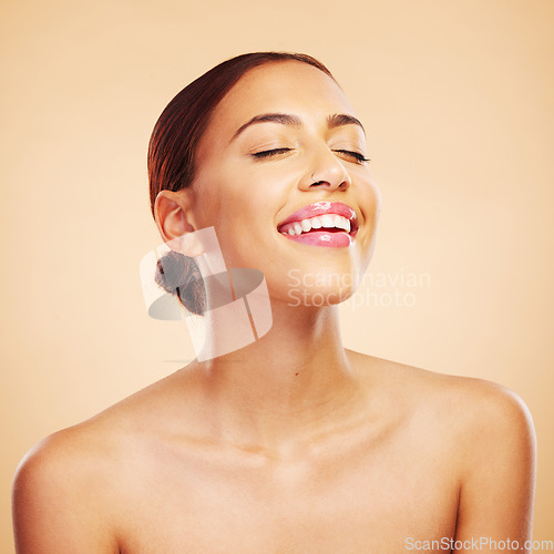 Image of Skincare, beauty and happy woman with eyes closed in studio isolated on a brown background. Face, makeup cosmetics and natural model with spa facial treatment for aesthetic, wellness and healthy skin