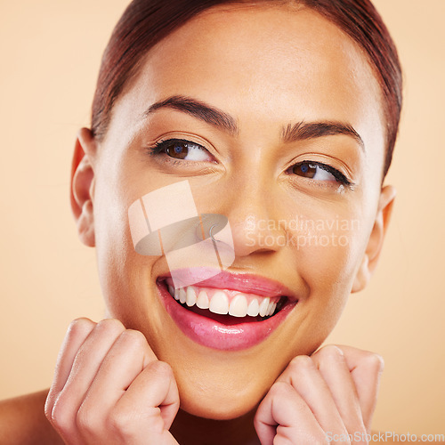 Image of Skincare, face touch and woman smile in studio isolated on a brown background. Makeup cosmetic, excited and model with spa facial treatment for dermatology, beauty aesthetic or wellness for health