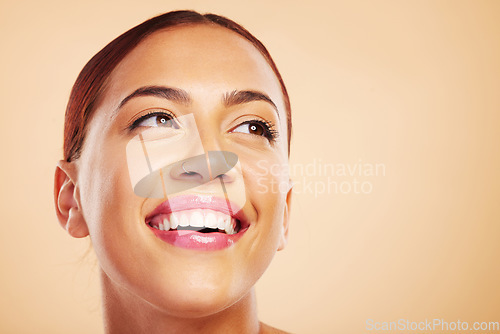 Image of Face, beauty skincare and woman thinking in studio isolated on a brown background mockup space. Cosmetic, natural and happy model with spa facial treatment for dermatology, aesthetic and wellness