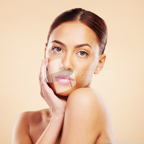 Image of Portrait, beauty and woman with skincare, makeup and dermatology against a brown studio background. Face, female person or model with luxury, wellness and healthy skin with shine, glow and aesthetic