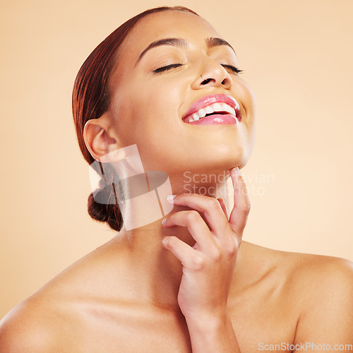 Image of Skincare, beauty and happy woman with eyes closed in studio isolated on a brown background. Face, makeup cosmetics and natural model touch neck after facial treatment for wellness and healthy skin