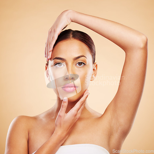 Image of Portrait, shine and woman with skincare, cosmetics and makeup against a brown studio background. Face, female person or model with luxury, organic facial or self care with wellness, glow or aesthetic