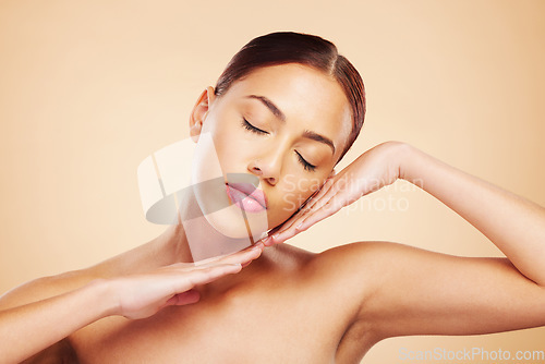 Image of Face, calm or woman with natural beauty in studio isolated on brown background for wellness or glow. Skin care shine, hands or zen Brazilian girl model with self love, eyes closed or facial cosmetics