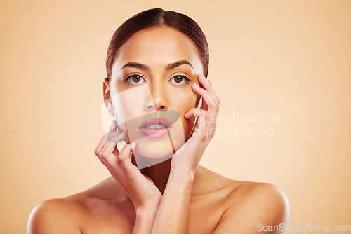 Image of Portrait, mockup and woman with skincare, cosmetics and wellness on a brown studio background. Face, female person and model with luxury, makeup and self care with shine, natural beauty and aesthetic