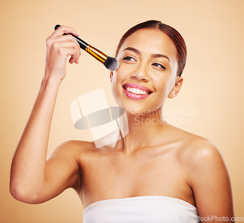 Image of Makeup, brush and woman with cosmetic beauty application of product for skincare isolated in studio brown background. Happy, elegant and powder for cosmetology aesthetic, glow and soft skin glamour