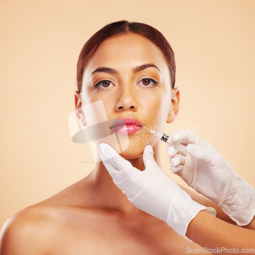 Image of Filler, plastic surgery and face of woman with beauty treatment for isolated in brown studio background. Skincare, cosmetics and portrait of person with syringe for facial or medical transformation