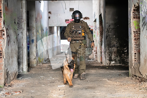 Image of Modern Warfare Soldiers with military working dog in action on the battlefield.