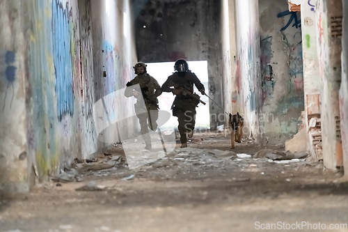 Image of Modern Warfare Soldiers with military working dog in action on the battlefield.