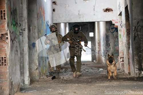 Image of Modern Warfare Soldiers with military working dog in action on the battlefield.