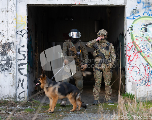 Image of Modern Warfare Soldiers with military working dog in action on the battlefield.