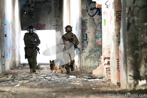 Image of Modern Warfare Soldiers with military working dog in action on the battlefield.
