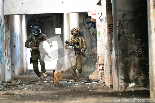 Image of Modern Warfare Soldiers with military working dog in action on the battlefield.