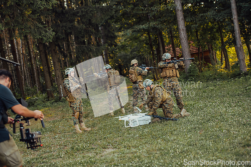 Image of Modern Warfare Soldiers Squad are Using Drone for Scouting and Surveillance During Military Operation in the Forest.
