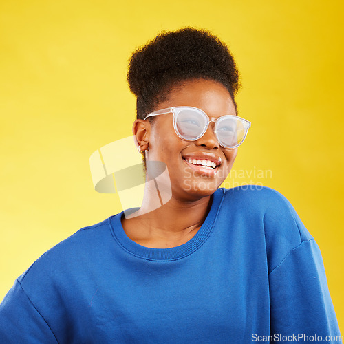 Image of Woman, smile and studio with glasses and happy with eye care and yellow background. Face, African female person and model with eyewear, new frame and fashion with modern style and confidence of girl