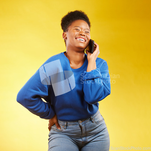 Image of Phone call, laugh and black woman in studio happy, silly or share joke on yellow background. Funny, talking and African lady with goofy, gossip or conversation on smartphone for online communication