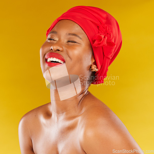 Image of Beauty, African and black woman with makeup and head wrap with smile isolated in yellow studio background. Happy, skin and skincare by young female person scarf for dermatology, wellness or cosmetics