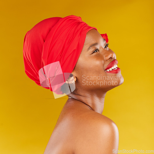 Image of Beauty, thinking and African woman with makeup and head wrap with smile isolated in yellow studio background. Happy, skin and skincare by young person scarf for dermatology, wellness or cosmetic
