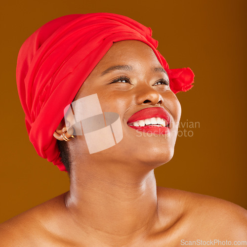 Image of Beauty, thinking and black woman with skincare and head wrap with smile isolated in brown studio background. Happy, skin and makeup of young female person scarf for dermatology, wellness or cosmetics