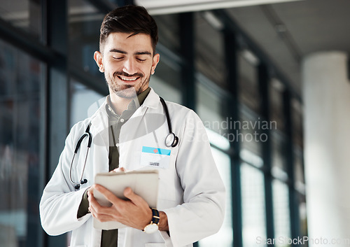 Image of Happy, doctor and man with tablet in hospital for Telehealth, advice and social chat or research. Healthcare, news and male health expert smile for online, website or internet communication at clinic