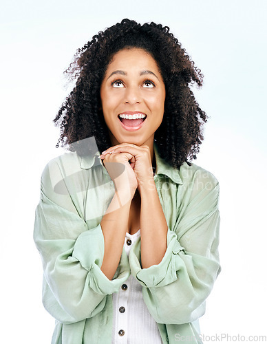 Image of Hope, woman and smile looking above for model, luck and gratitude feeling excited in studio. Thank you, happy and blessing hand gesture with a female person with white background and forgiveness