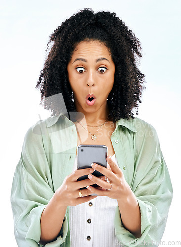 Image of Phone, wow or woman with surprise gossip or fake news isolated on a white background in studio. Girl, blog search or shocked person reading scam on social media post, mobile app or promo announcement