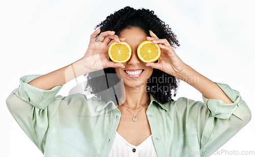 Image of Citrus, lemon and eyes of woman with fashion for organic wellness isolated in studio white background. Diet, fruit and happy or excited young person with healthy vitamin c energy, crazy and detox