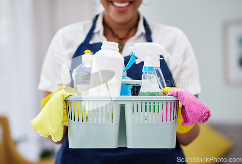 Image of Cleaning, chemical and basket with hands of woman in living room for hygiene, dust and bacteria. Spray, tools and equipment with closeup of female cleaner at home for housekeeping, health and product